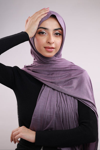 Model wearing a Cotton Jersey Hijab in Dusty Purple color made with non-slippery fabric, Hijab for sale in Pakistan.