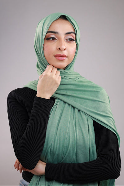 Model wearing a Cotton Jersey Hijab in Match Green color made with non-slippery fabric, Hijab for sale in Pakistan.