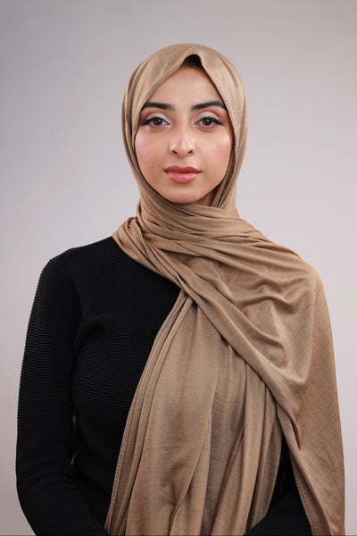 Model wearing a Cotton Jersey Hijab in Taupe color made with non-slippery fabric, Hijab for sale in Pakistan.
