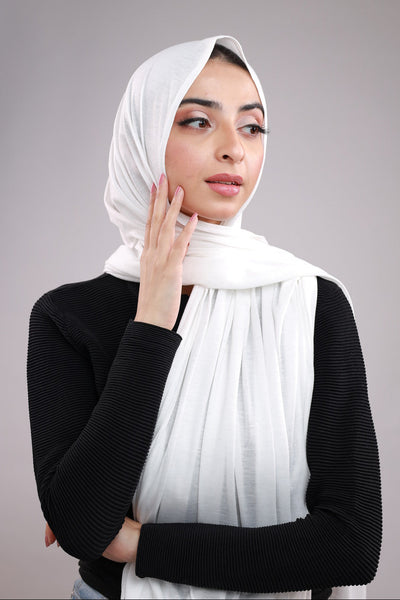 Model wearing a Cotton Jersey Hijab in White color made with non-slippery fabric, Hijab for sale in Pakistan.