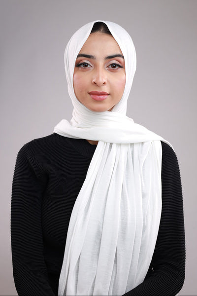 Model wearing a White Cotton Jersey Hijab in soft, non-slippery fabric. Full-coverage hijab for sale in Pakistan.