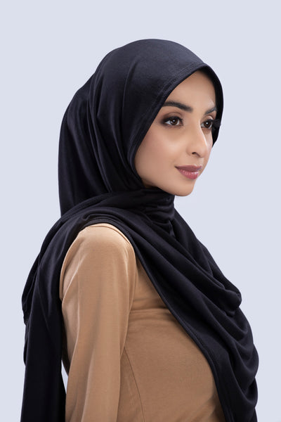 Model wearing a Cotton Jersey Hijab in Black color made with non-slippery fabric, Hijab for sale in Pakistan.