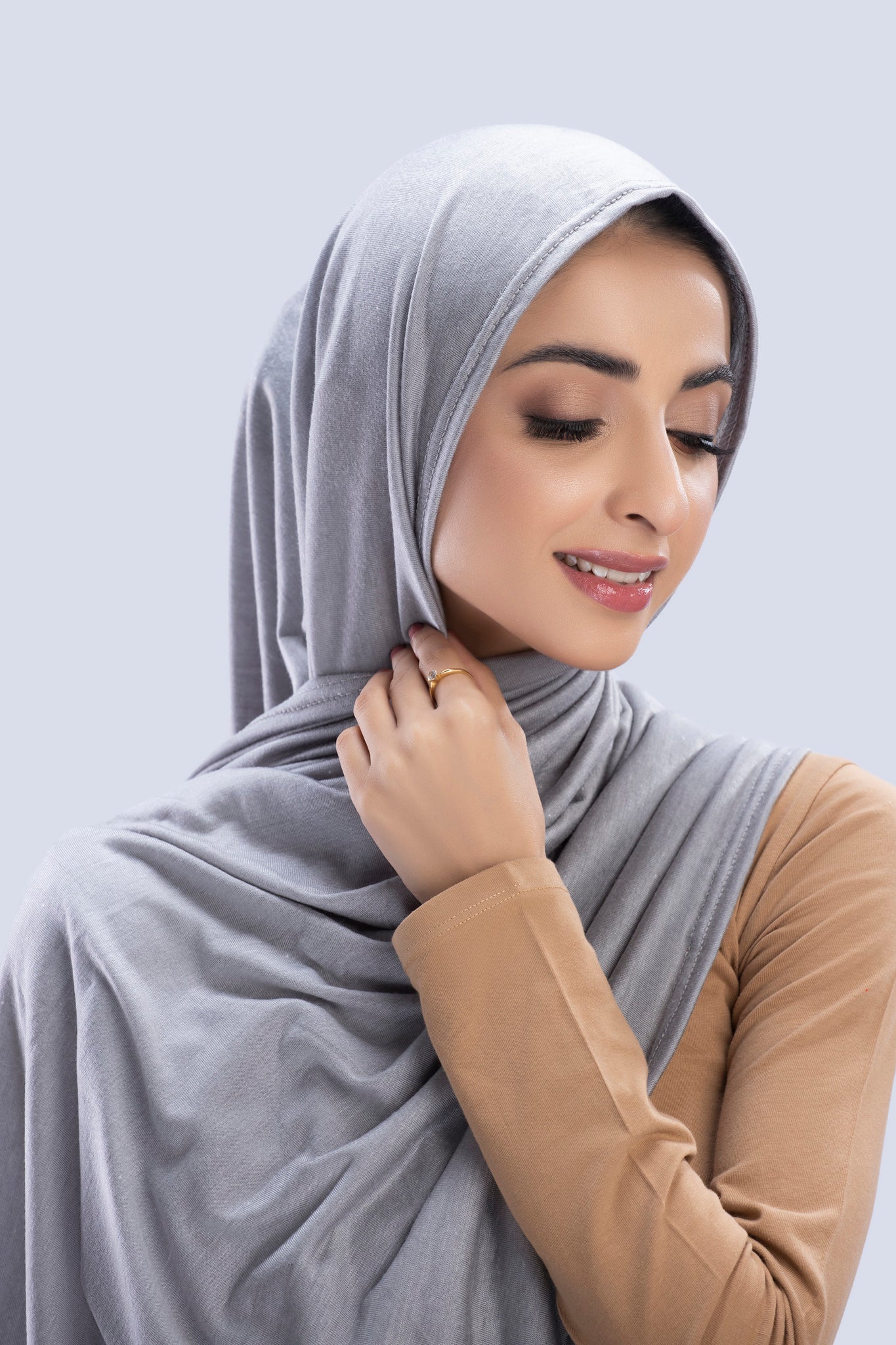 Model wearing a Dove Grey Cotton Jersey Hijab in soft, non-slippery fabric. Full-coverage hijab for sale in Pakistan.