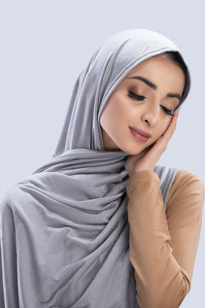 Model wearing a Cotton Jersey Hijab in Dove Grey color made with non-slippery fabric, Hijab for sale in Pakistan.