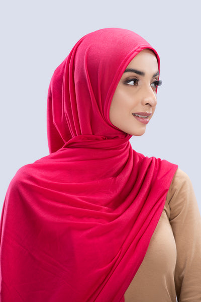 Model wearing a Cotton Jersey Hijab in Fuchsia color made with non-slippery fabric, Hijab for sale in Pakistan.