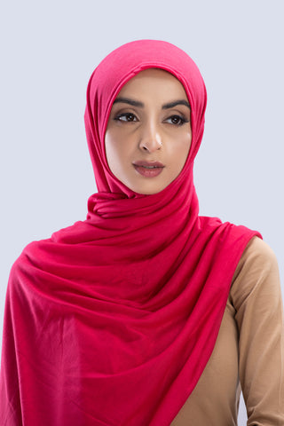 Model wearing a Fuchsia Cotton Jersey Hijab in soft, non-slippery fabric. Full-coverage hijab for sale in Pakistan.