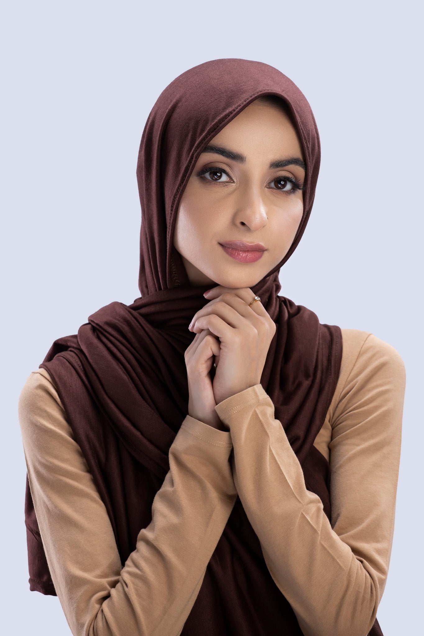 Model wearing a Nutella Cotton Jersey Hijab in soft, non-slippery fabric. Full-coverage hijab for sale in Pakistan.