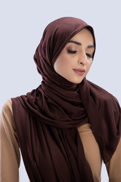 Model wearing a Cotton Jersey Hijab in Nutella color made with non-slippery fabric, Hijab for sale in Pakistan.