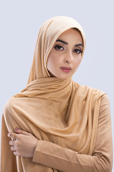 Model wearing a Peanut Cotton Jersey Hijab in soft, non-slippery fabric. Full-coverage hijab for sale in Pakistan.