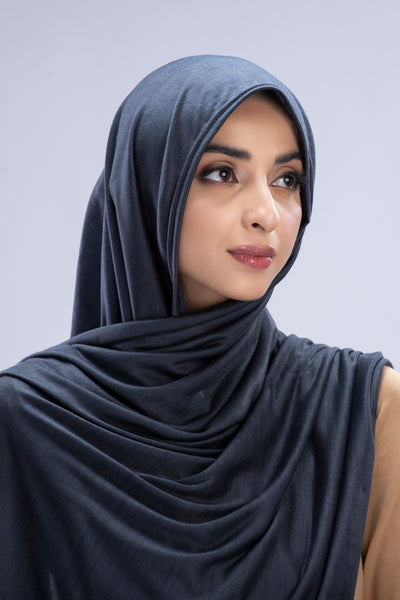 Model wearing a Cotton Jersey Hijab in Pebble color made with non-slippery fabric, Hijab for sale in Pakistan.