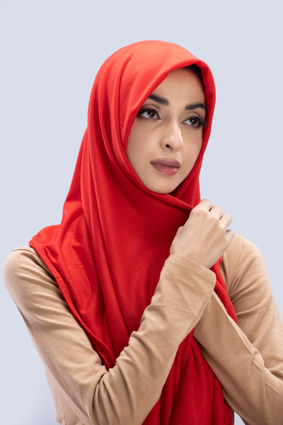 Model wearing a Cotton Jersey Hijab in Scarlet color made with non-slippery fabric, Hijab for sale in Pakistan.