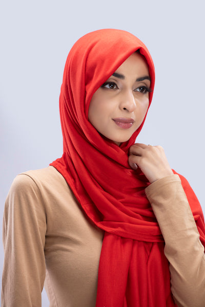 Model wearing a Scarlet Cotton Jersey Hijab in soft, non-slippery fabric. Full-coverage hijab for sale in Pakistan.