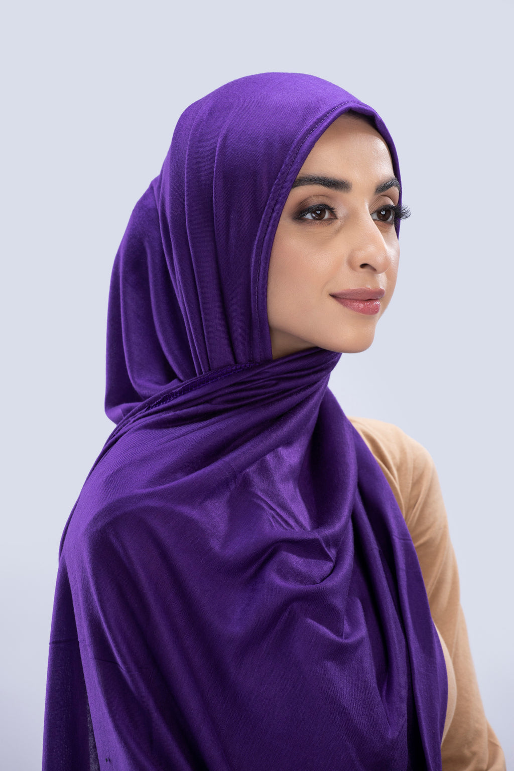 Model wearing a Cotton Jersey Hijab in Violet color made with non-slippery fabric, Hijab for sale in Pakistan.